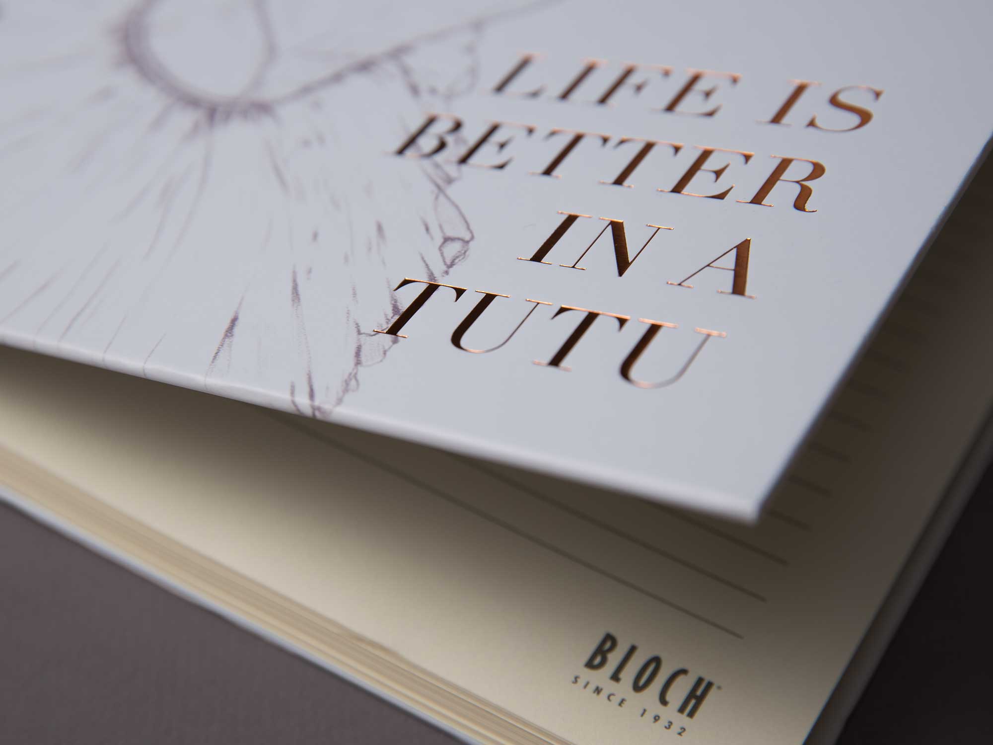 'Life is Better in a Tutu' bronze embossed type